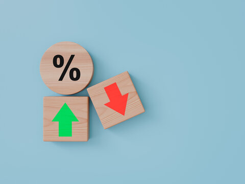 Wooden blocks featuring a percentage symbol alongside green upward and red downward direction arrows
