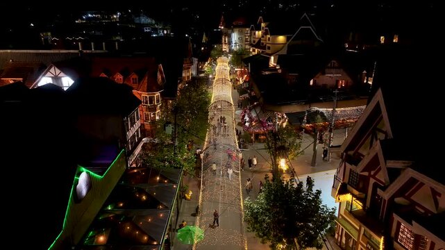 Night View Of Capivari Village In Campos Do Jordao In Sao Paulo Brazil. Illuminated Ferris Wheel. Downtown Cityscape. European Architecture. Capivari Village In Campos Do Jordao In Sao Paulo Brazil. 
