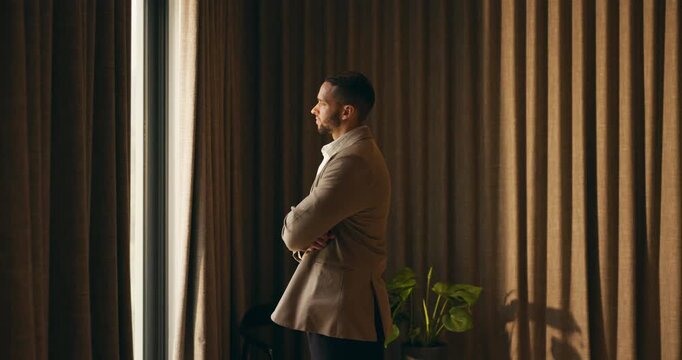 Hotel, window and businessman with arms crossed, think and plan for investment opportunity or ideas. Business travel, entrepreneur and person with ambition for financial growth, pride and reflection