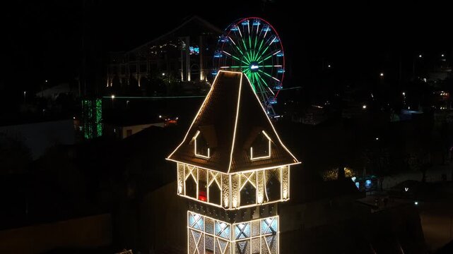 Night View Of Capivari Village In Campos Do Jordao In Sao Paulo Brazil. Illuminated Ferris Wheel. Downtown Cityscape. European Architecture. Capivari Village In Campos Do Jordao In Sao Paulo Brazil. 