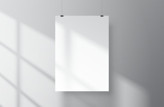 Vector realistic mockup of a white vertical A4 poster hanging on against a wall in an empty, minimalist interior. Print or product presentation template