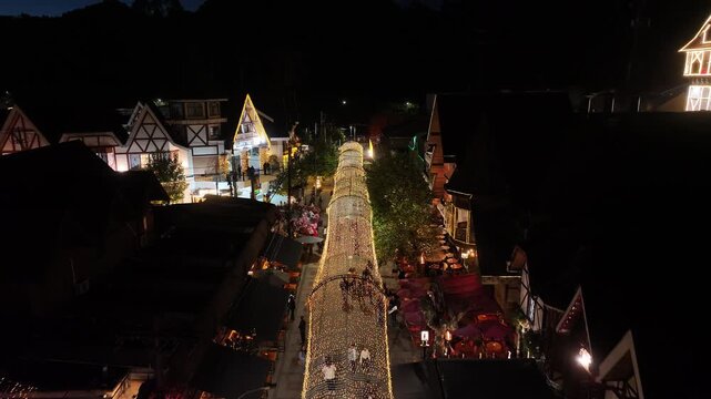 Night View Of Capivari Village In Campos Do Jordao In Sao Paulo Brazil. Illuminated Ferris Wheel. Downtown Cityscape. European Architecture. Capivari Village In Campos Do Jordao In Sao Paulo Brazil. 