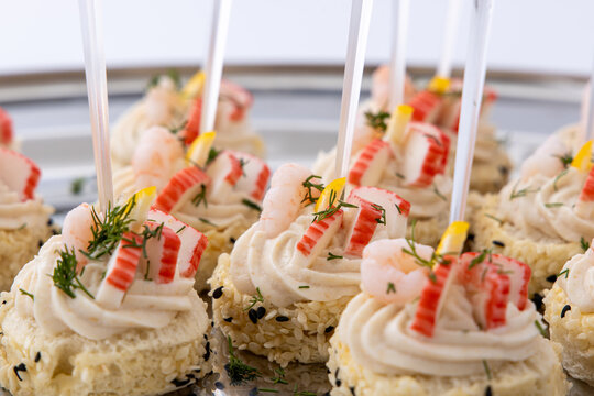 Elegant Seafood Canapes with Shrimp, Crab Sticks and Cream Cheese on Sesame Rice Bites, Gourmet Party Appetizers for Catering Events