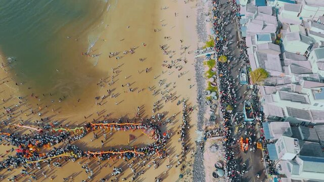 Drone Pull-away Shot of Coastal Festival and Embankment in Phuoc Hai