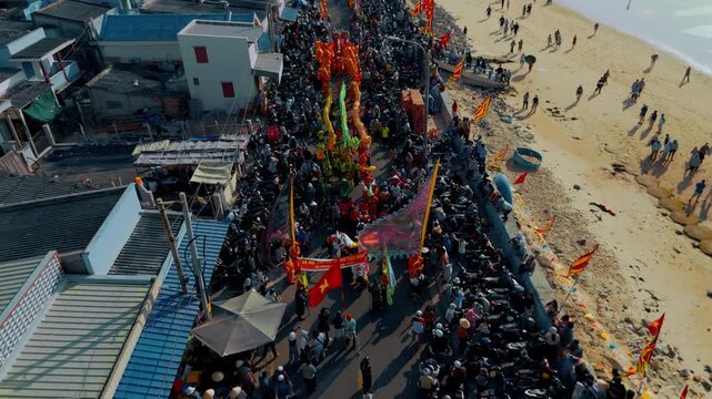 Drone Flying Backwards Over Phuoc Hai Coastal Festival Procession