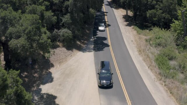 Tracking a Black SUV U-turn View Rural Mountain Road Los Angeles California