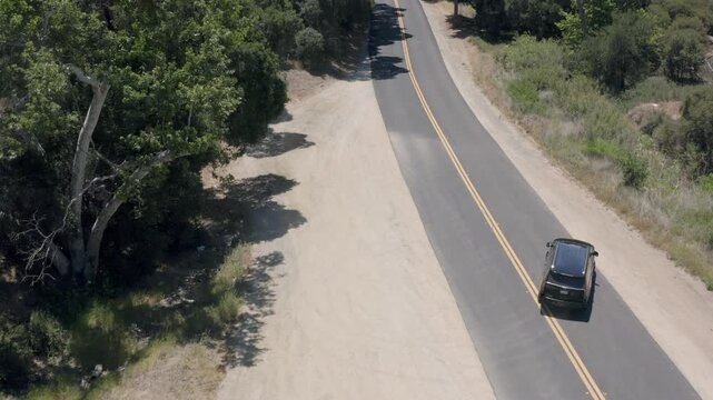 Tracking a Black SUV U-turn View Rural Mountain Road Los Angeles California