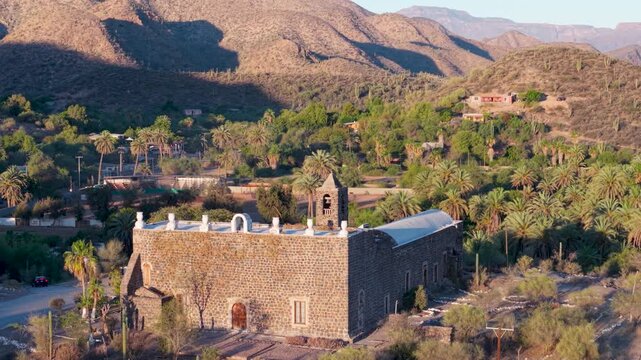 Take a look at Mission Church Santa Rosalia in Mulege Baja California Sur and the beautiful oasis and mountains nearby.