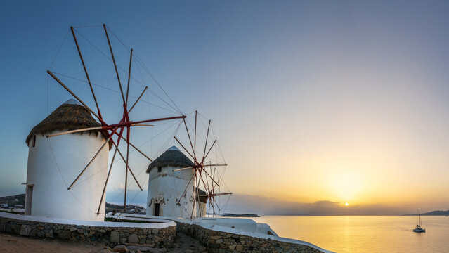 View of the famous windmills of Mykonos at sunset with copy space, Cyclades islands, Greece scenic landscape
