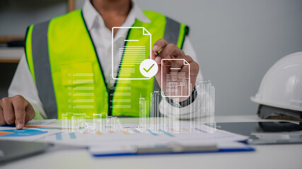 Engineer Using Digital Document Interface for Construction Project Management © Ao Zaa Studio