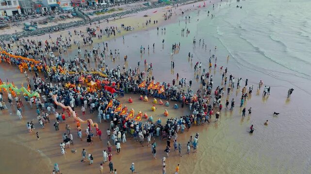 Aerial orbiting shot of Cheo Ba Trao team at Nghinh Ong Whale Festival, Vietnam