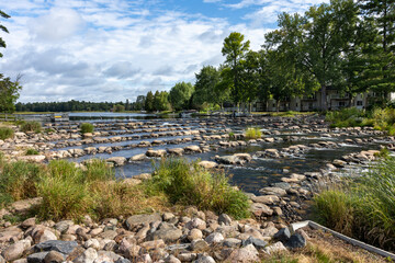 Obraz premium Scenic Pine River Dam and Waterfront Park with Rocky Rapids in Pine River Minnesota