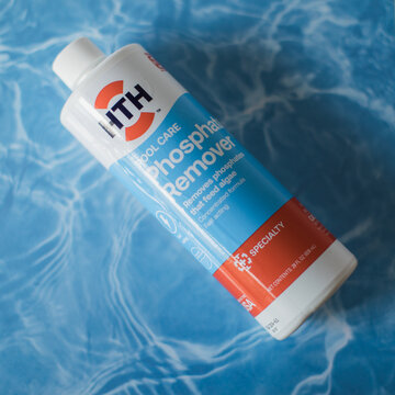 HTH Pool Care Phosphate Remover that feed algae on a pool water background 