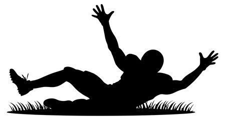 Fototapeta premium Silhouette of a football player performing a knee slide celebration