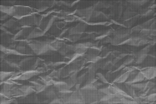 A close-up view of crumpled paper texture fills the entire frame.