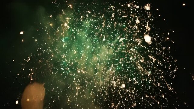 Spectacular Green and Yellow Fireworks Exploding in the Night Sky.