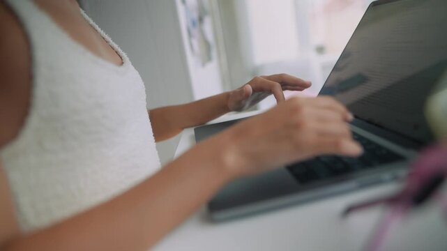 Energetic individual engaging in fast multitasking at bright workspace