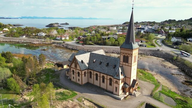 Majestic aerial view of the historic Vagan church, also known as the Lofoten Cathedral, nestled in the scenic coastal landscape of Kabelvag