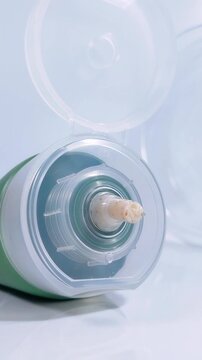 Beauty cream slowly coming out from product packaging. Oil control foam cleansing effective for preventing acne. White background close up view.