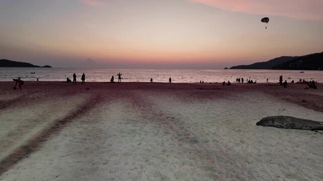 Tropical Beach Sunset With Parasailing Silhouette in Phuket Thailand
