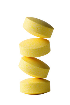 Yellow Round Tablets Stacked in Delicate Vertical Balance Isolated on Transparent Background PNG