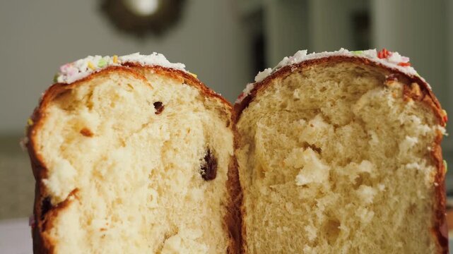 Close-up of panettone crumb texture with dried fruits. Traditional festive bakery dessert, sweet bread and holiday food concept. High quality 4k footage