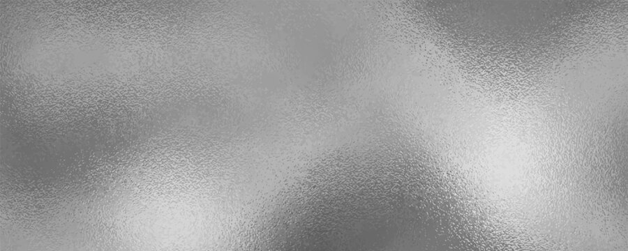 Shiny silver foil metallic texture - glossy gray steel gleaming surface, frosted glass effect with blur glare reflection, bright polished metal material.