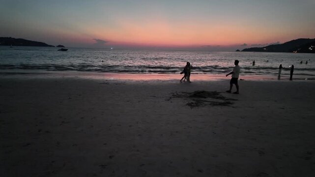 Parasailing Silhouette Above Tropical Beach Sunset in Phuket