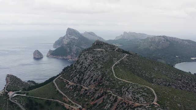 Aerial view of nature landscape of Serra de Tramuntana mountains in Mallorca. Mountain ranges and roads on them, island in the Mediterranean, travel and tourism in Europe and Spain.