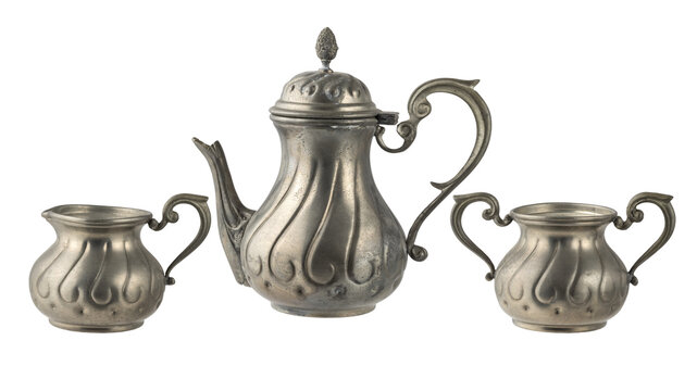 Old grunge craft tin set : coffee pot, sugar bowl and milk jug isolated on white. Pewter coffee tableware.