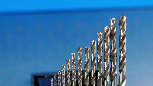 A set of drills for drilling metal in a plastic case.