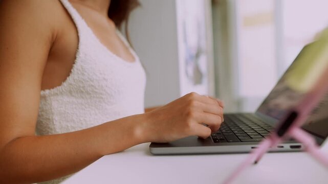 Creative woman pauses to sketch and organize ideas quietly