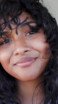 Happy Latin woman smiling in front of camera - Young female lifestyle concept - Vertical video