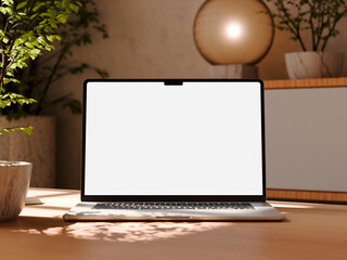 Black laptop with blank dark screen on dark wooden table with stylish accessories in dim lighting © CreatifyStudio