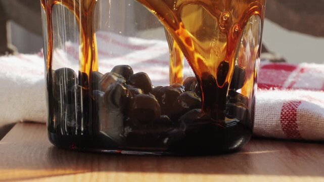 Cooking, boiling brown sugar flavor tapioca pearl balls, chinese food, ingredient of bubble tea, preparing food and drink, close up, recipe cookbook steps design concept.