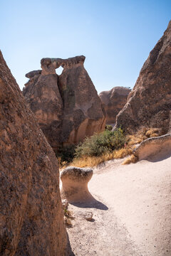 vertical photograph of fairy chimneys in Cappadocia during an August day