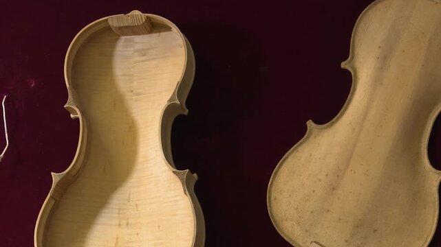Bilbao, spain; may 21 2022: luthier craftsmanship with unfinished violin parts