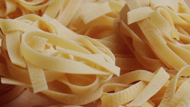 Italian tagliatelle pasta packaging window, Fettuccine pasta, close up, not cooked