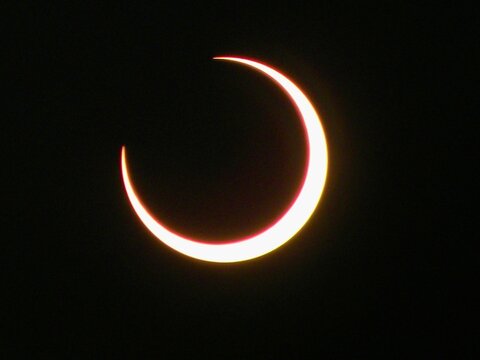 Closeup of Partial Solar Eclipse with Bright Crescent Sun