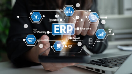 Fototapeta premium A business professional interacts with a smartphone displaying various ERP symbols, illustrating modern technology role in enhancing enterprise management and efficiency. Tessel
