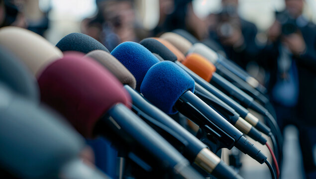 Row of Microphones at a Press Conference.