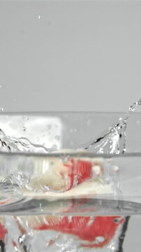 Crab sticks fall into the water. Filmed on a high-speed camera at 1000 fps. High quality FullHD footage