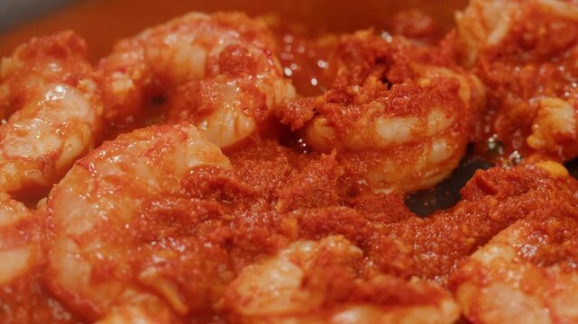 Tamarind red prawn curry cooking, shrimps in tomato ginger sauce, asian kitchen, Chinese restaurant.