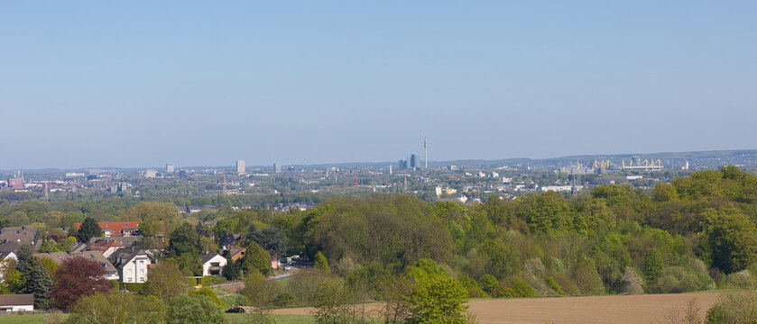 The skyline of Dortmund, Germany, featuring the Floriansturm and the football stadium.