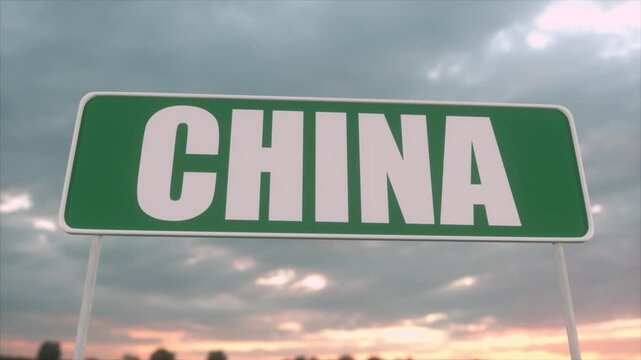 Large Green China Road Sign Against Dramatic Cloudy Sunset Sky