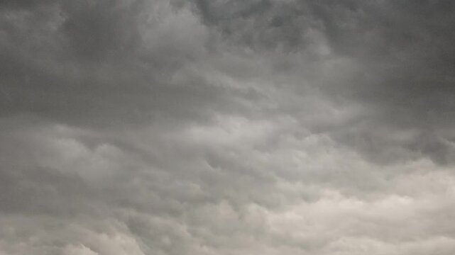 Sky before storm. Stormy cloudy sky wide panorama. Storm cloudy dramatic sky with dark rain grey cumulus cloud and blue sky. Timelapse.