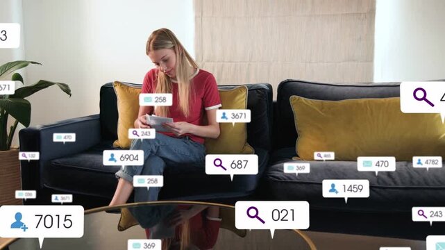 Woman tapping phone, causing numeric callouts growing around room while reading mail in finance