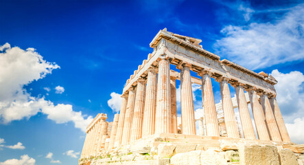 Fototapeta premium Parthenon temple over bright blue sky background, Acropolis hill, Athens Greece, web banner format