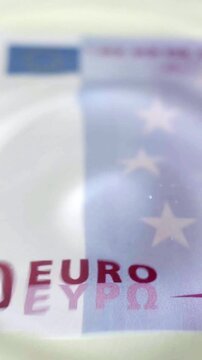 Drops of water and waves with a bill of five hundred euros concept of growing economy