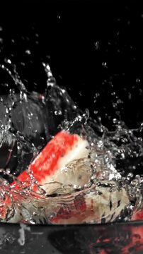 Crab sticks fall into the water. Filmed on a high-speed camera at 1000 fps. High quality FullHD footage
